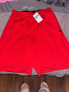 Nike Red Men's Athletic Mesh Shorts with Black Swoosh
